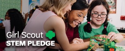 Girl Scout STEM Pledge Girls and volunteer experiencing STEM programming
