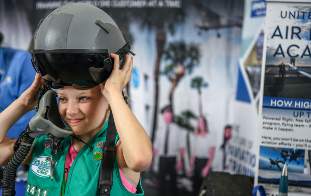 Girl scout with airline helmet at American airlines day