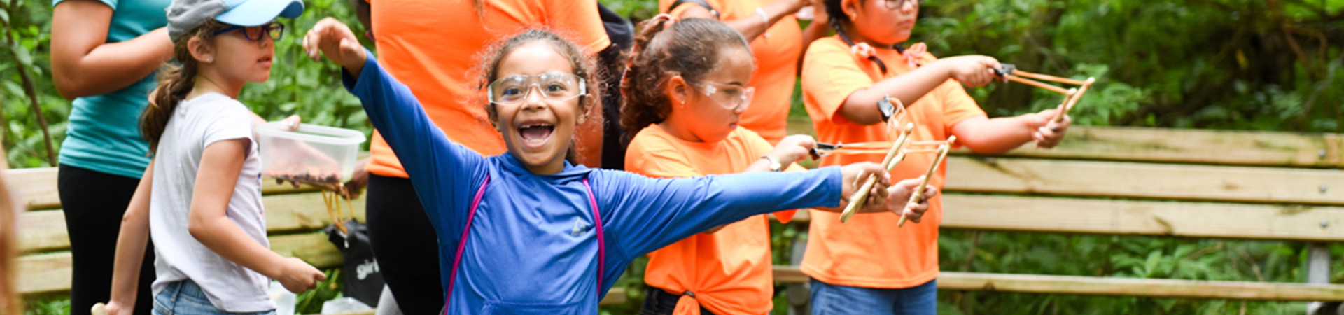  group of young girl scouts outside cheering 