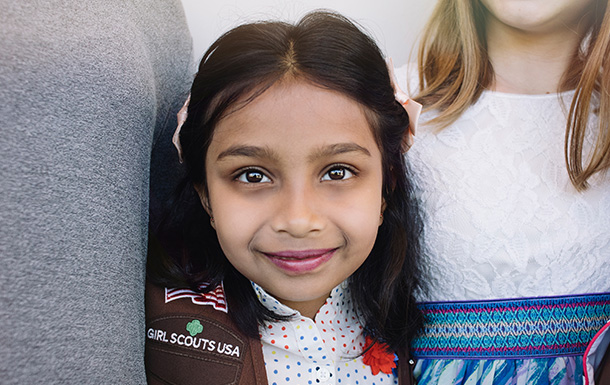 young girl outside smiling