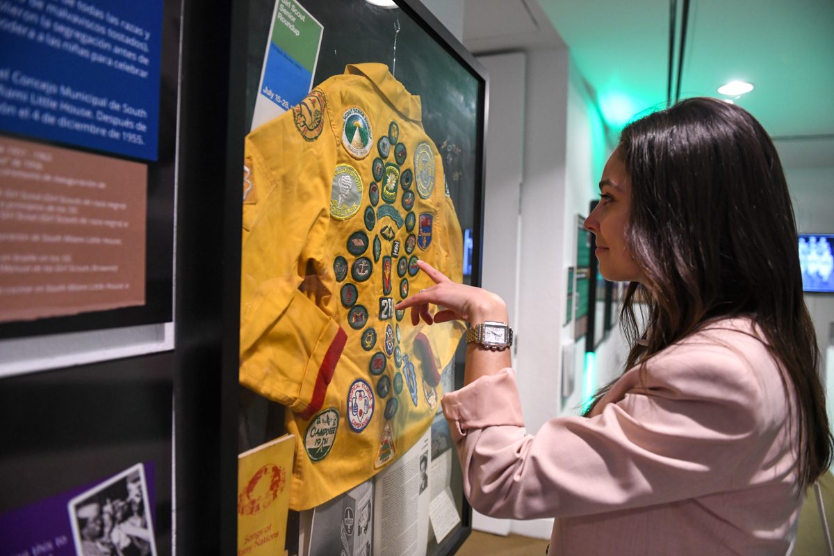 Woman looking at Girl Scout exhibit
